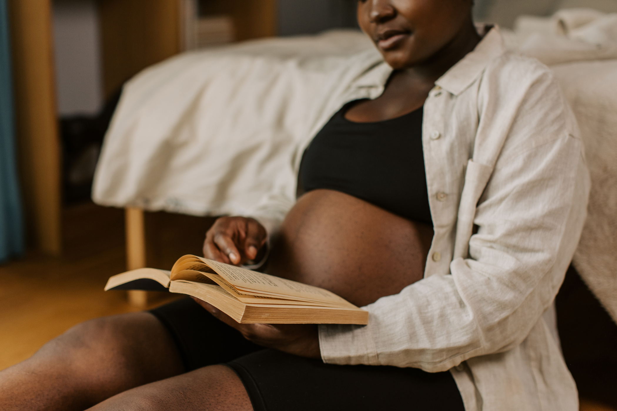 Pregnancy at Home Pregnant Woman Reading a Book